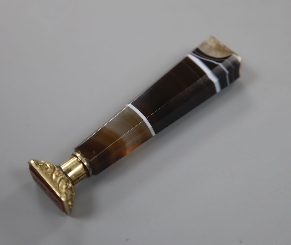 A late Victorian agate handled gilt white metal and carnelian set seal, 68mm.